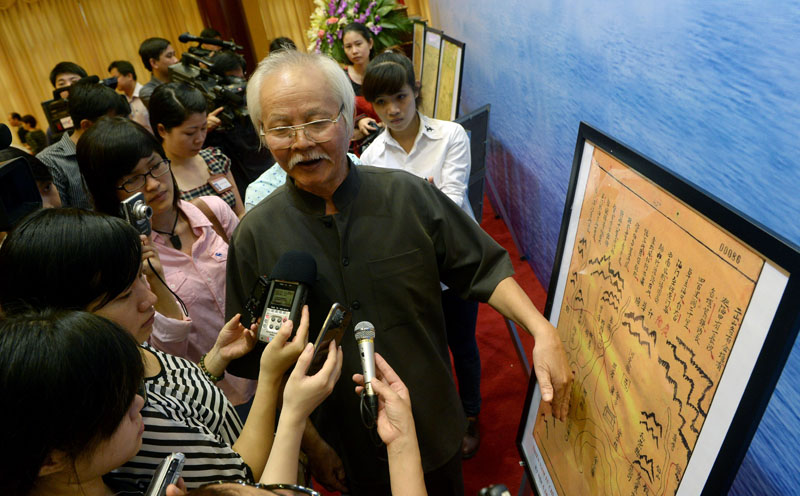 Nguyen Ta Nhi, a researcher from the Vietnam Academy of Social Sciences (VASS), introduces reporters to documents from the 17 and 18th centuries associated with Vietnam's claim to sovereignty over the Paracel islands, June 3, 2014, in Hanoi. HOANG DINH NAM/AFP/Getty Images.