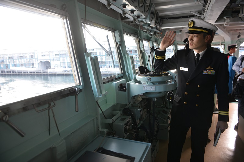 A Japanese navy officer (R) is seen on the bridge of the Japanese Asagiri-class destroyer, JDS Umigiri docked in Sydney's Naval base during a media tour on April 19, 2016. The destroyer along with the Japanese Hatsuyuki class destroyer JS Asayuki and The Soryu class stealth submarine Hakuryu are taking part in the annual bilateral Nichi Gou Trident exercise series with the Royal Australian Air Force and Royal Australian Navy from 15-26 April. / AFP / PETER PARKS (Photo credit should read PETER PARKS/AFP/Getty Images)