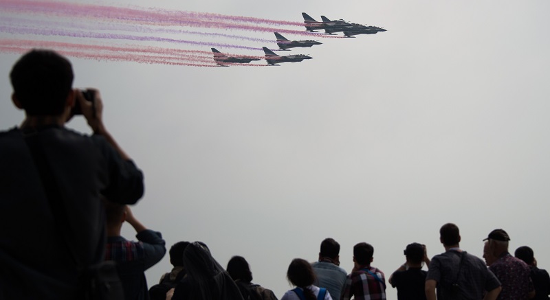 J-10 fighter jets of the Bayi Aerobatic Team of PLA's (Peoples Liberation Army) Air Force perform at the Airshow China 2014 in Zhuhai, south China's Guangdong province on November 12, 2014. The 10th Airshow China 2014 takes place from November 11 to 16. AFP PHOTO / JOHANNES EISELE (Photo credit should read JOHANNES EISELE/AFP/Getty Images)