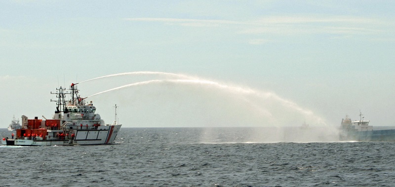 An Indonesian Coast Guard vessel, The Kn Trisula, sprays water during a 2007 exercise. (© Tara Yap/AFP/Getty Images)