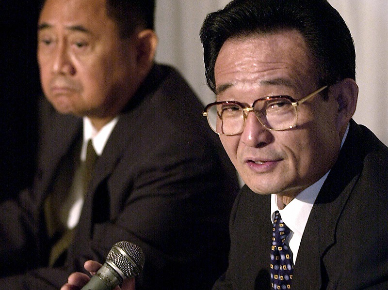 Chinese parliamentary leader Wu Bangguo speaks during an August 2003 trip to Manila. Wu discussed a joint oil exploration and development plan for the Spratly Islands. JOEL NITO/AFP/Getty Images.