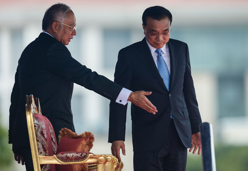 Malaysia's Prime Minister Najib Razak gestures to China's Premier Li Keqiang during a meeting in Putrajaya on November 23, 2015. MOHD RASFAN/AFP/Getty Images.