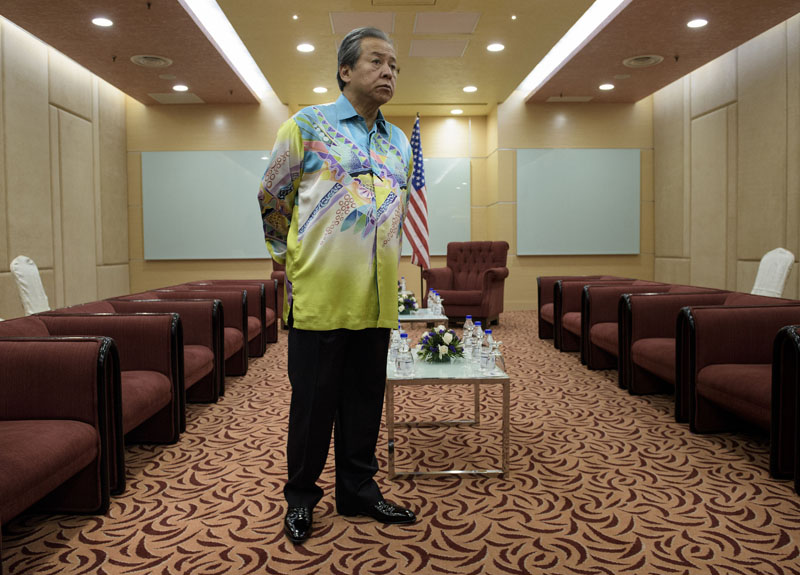 Malaysia's Foreign Minister Anifah Aman waits for US Secretary of State John Kerry before a bilateral meeting in Kuala Lumpur on August 5, 2015 . BRENDAN SMIALOWSKI/AFP/Getty Images.